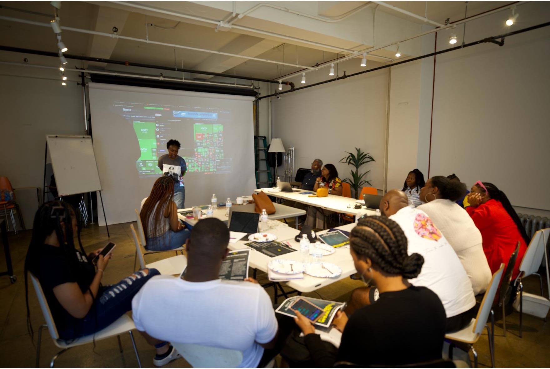 Alexandria guiding clients through a previous financial education session